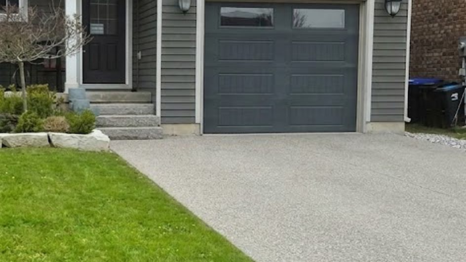 Front lawn edged clean along the driveway of a Collingwood home