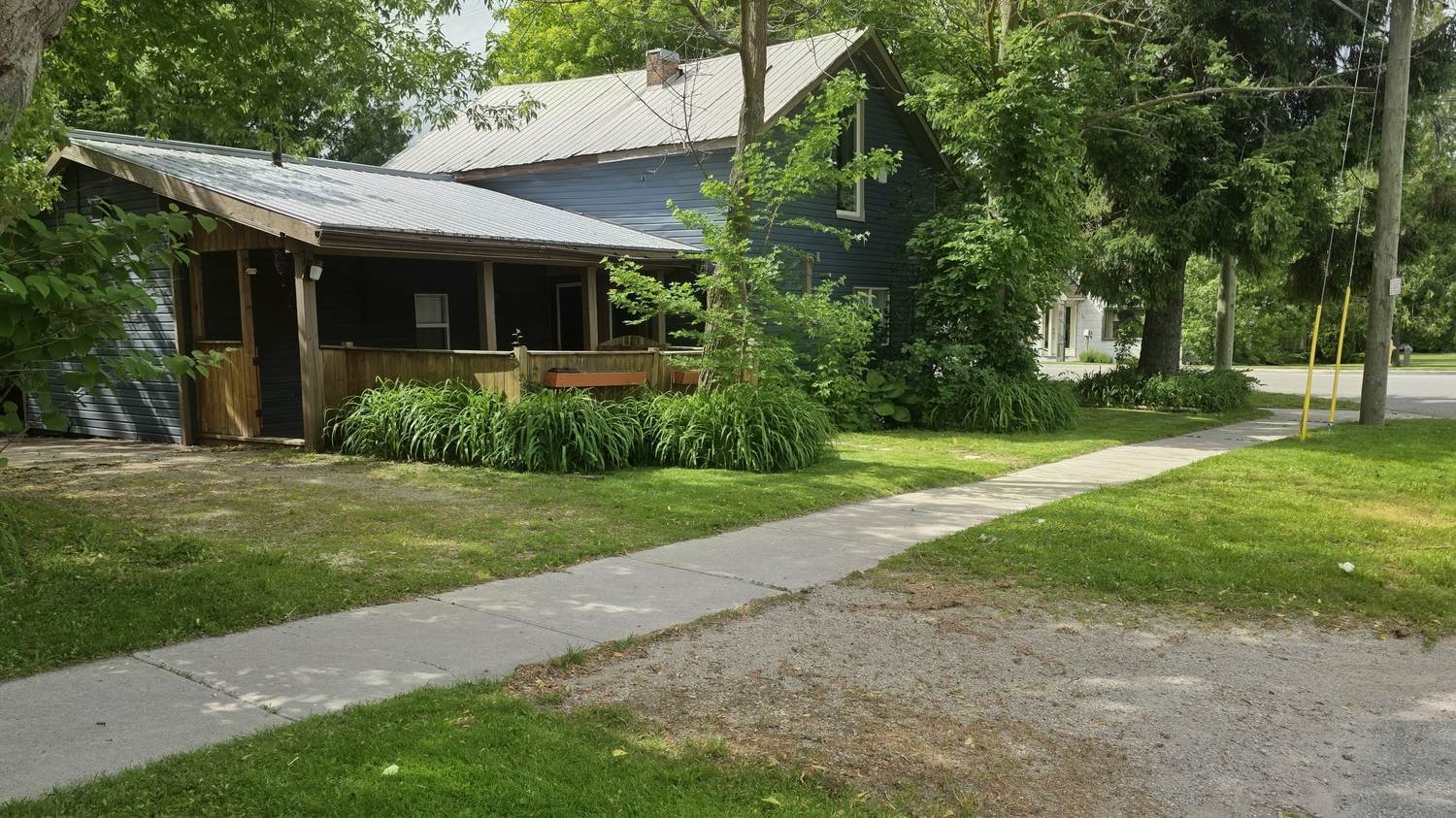 Front lawn and boulevard cut clean along the sidewalk of a Collingwood street